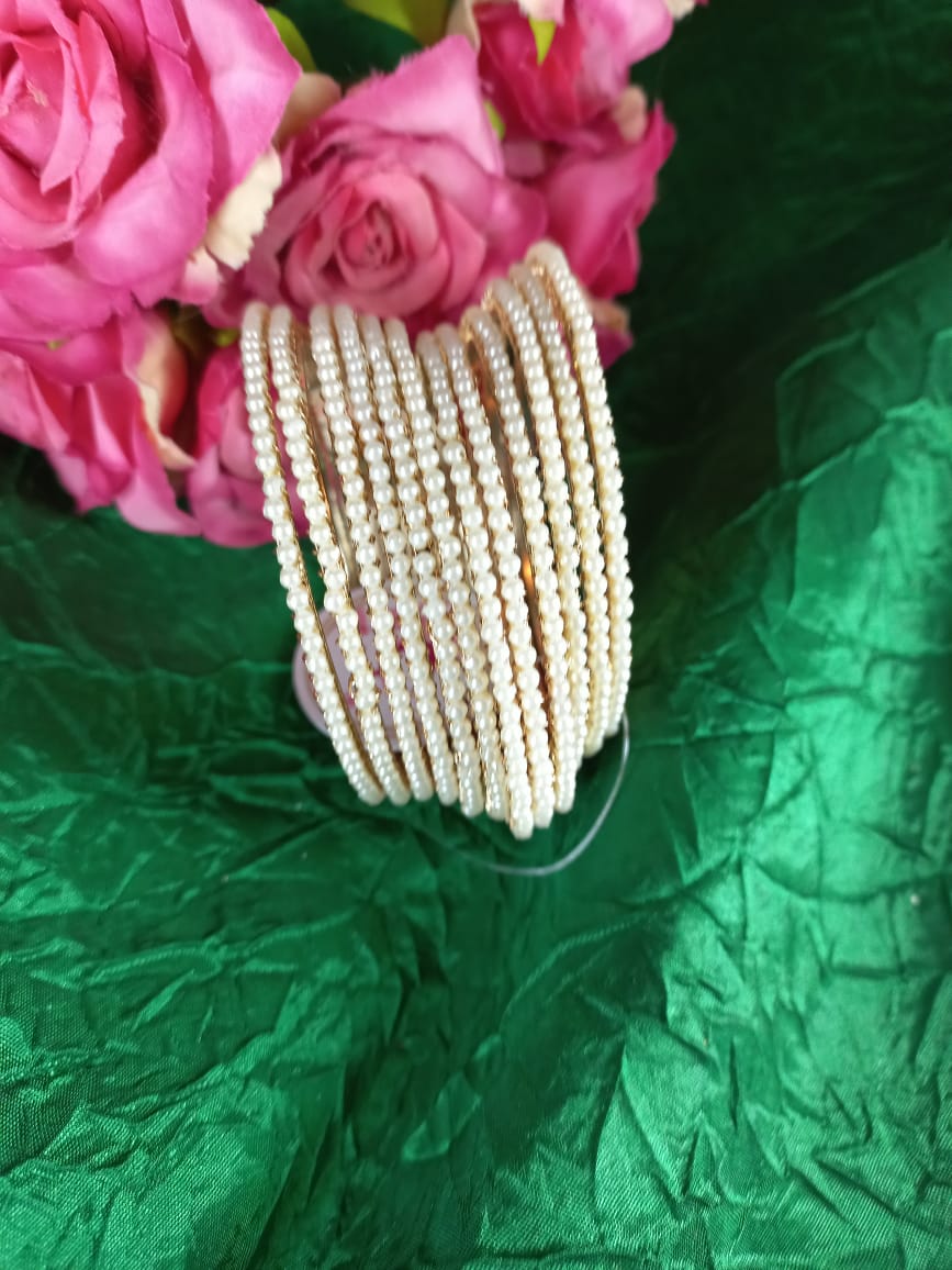 12-piece-pearl-bangle-set-fFor-R150-1.jpeg Crystal stoned bangles with pearls