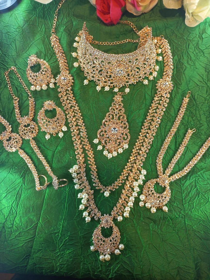Rose-gold-crystal-bridal.jpeg Gold and red crystal bridal set