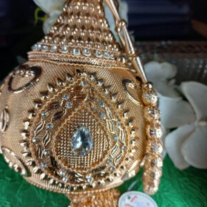 Rose gold metal potli bag
